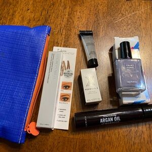 Ipsy makeup bags (3) with 14 different products. New, never opened.